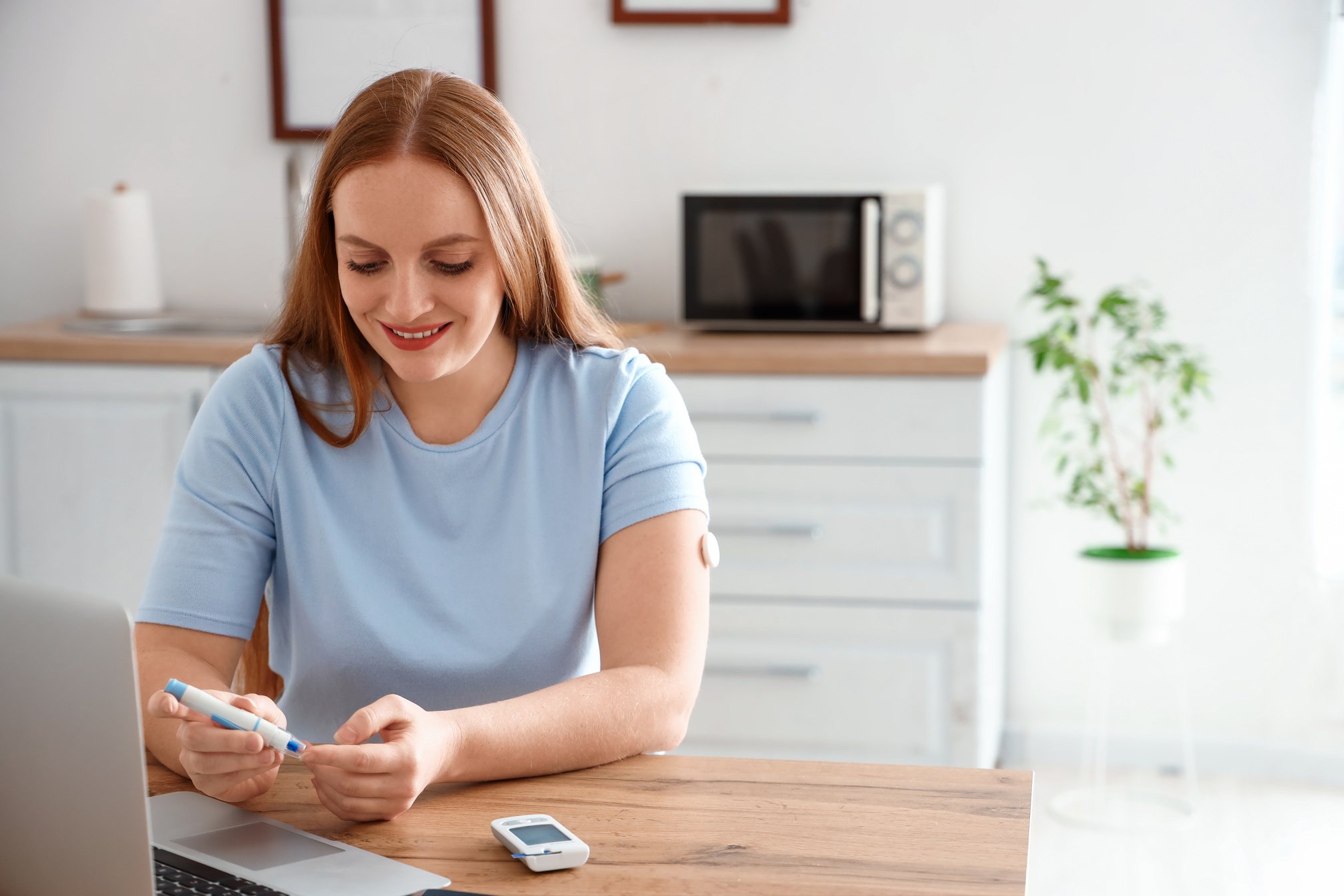 Woman with Diabetes Measuring Blood Sugar Level at Home